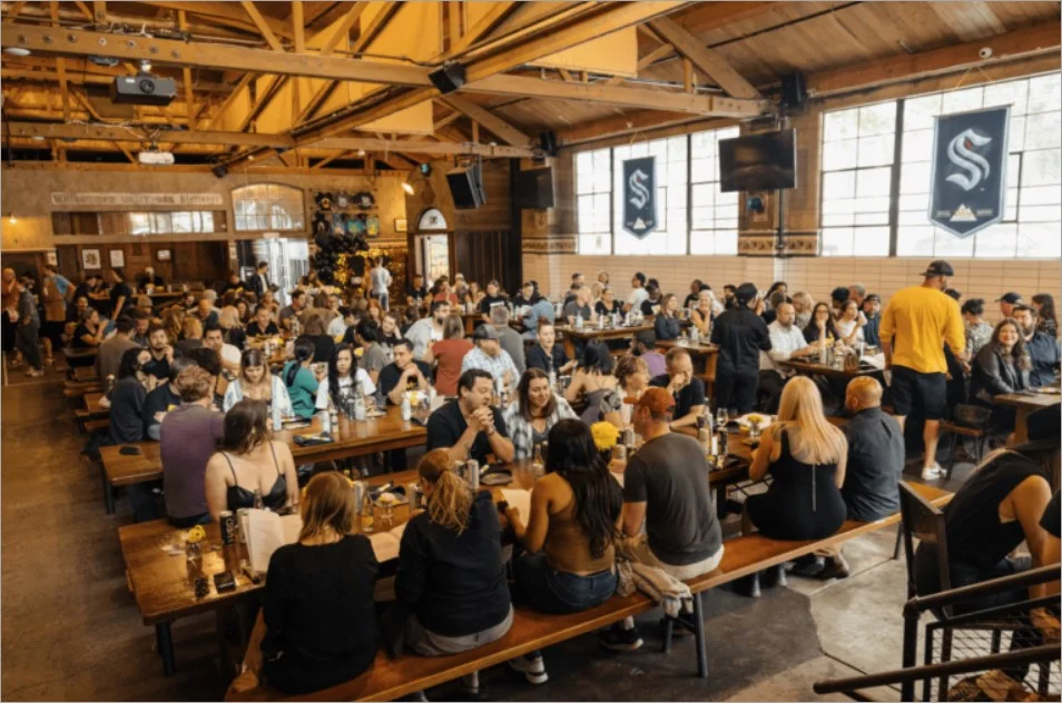 A community event held at a local restaurant where attendees enjoy food and live music.
