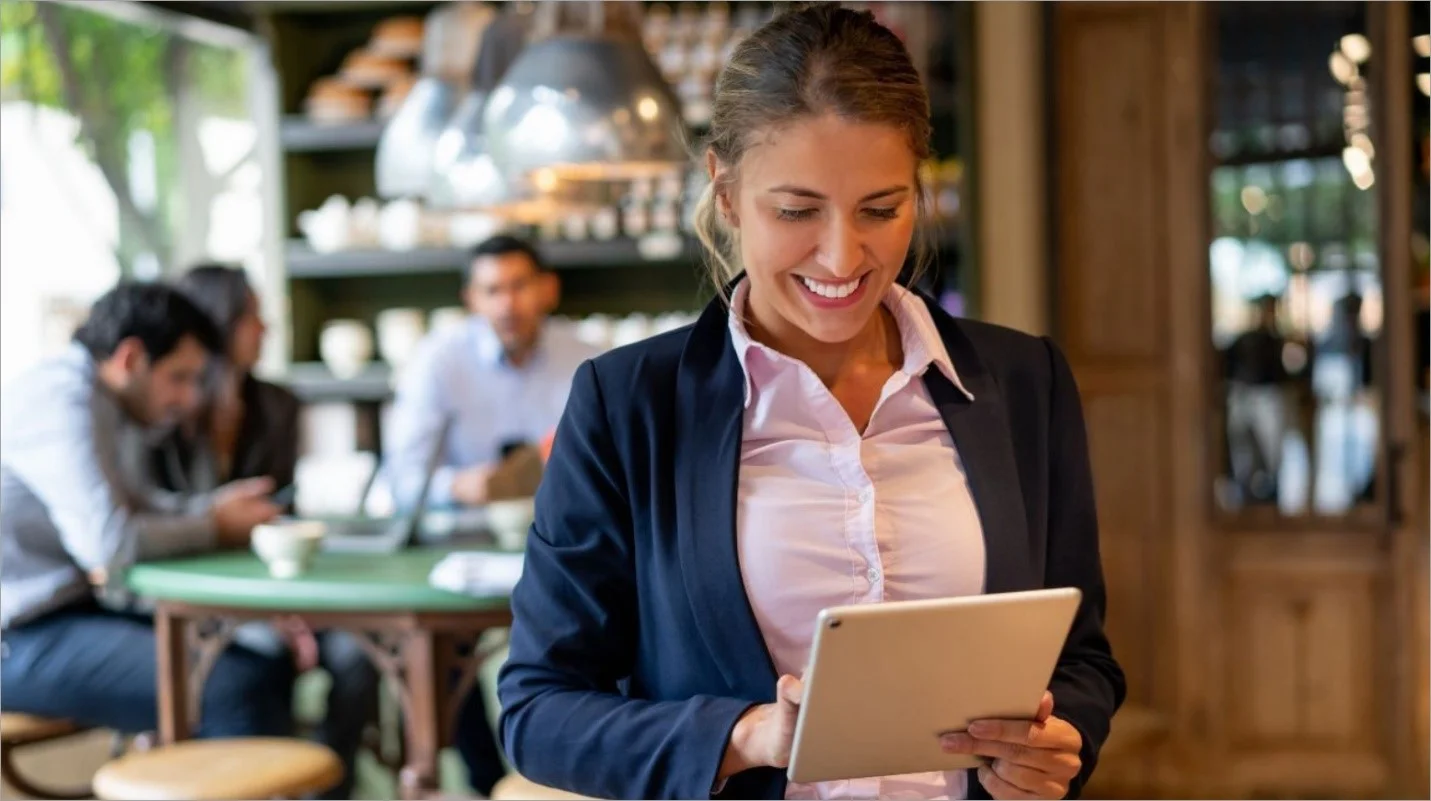A restaurant manager who uses a tablet to manage reservations and customer information.