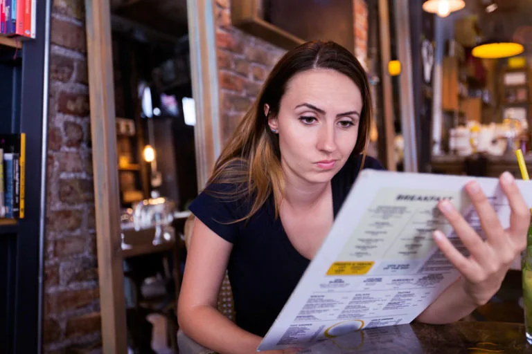 Lady looking at a menu
