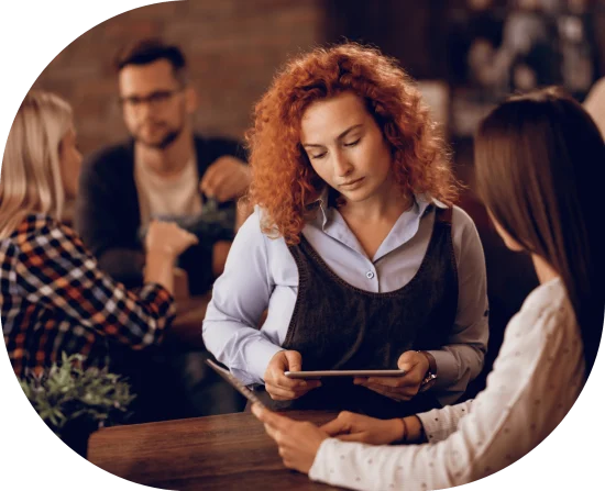 Restaurant staff using tablet ordering app